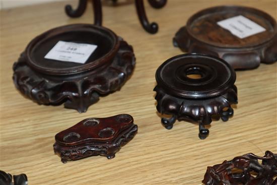 A group of seven Chinese carved wood stands, 19th / 20th century